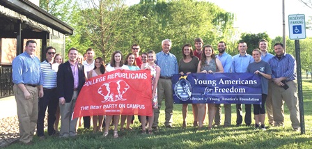 Young Republicans holding their banner with state legislators