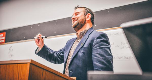 ETSU Political Science professor at the lectern in front of the classroom