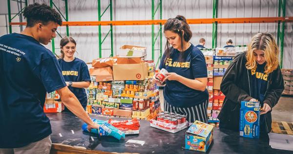 A group of ETSU students packing food boxes for those in need