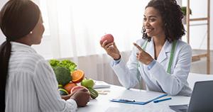 Dietitian teaching client about foods and nutrition