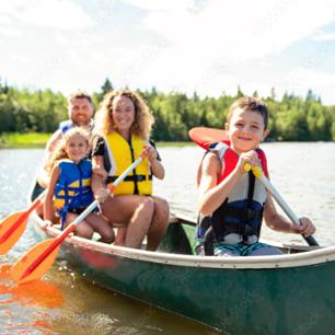 A picture of a family on a boat on a hot summer day.