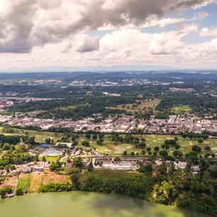 An overview of Northeast Tennessee with lake water, houses, mountains and more.