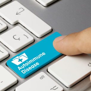 A keyboard with a blue button with white text that says, "Autoimmune Disease".