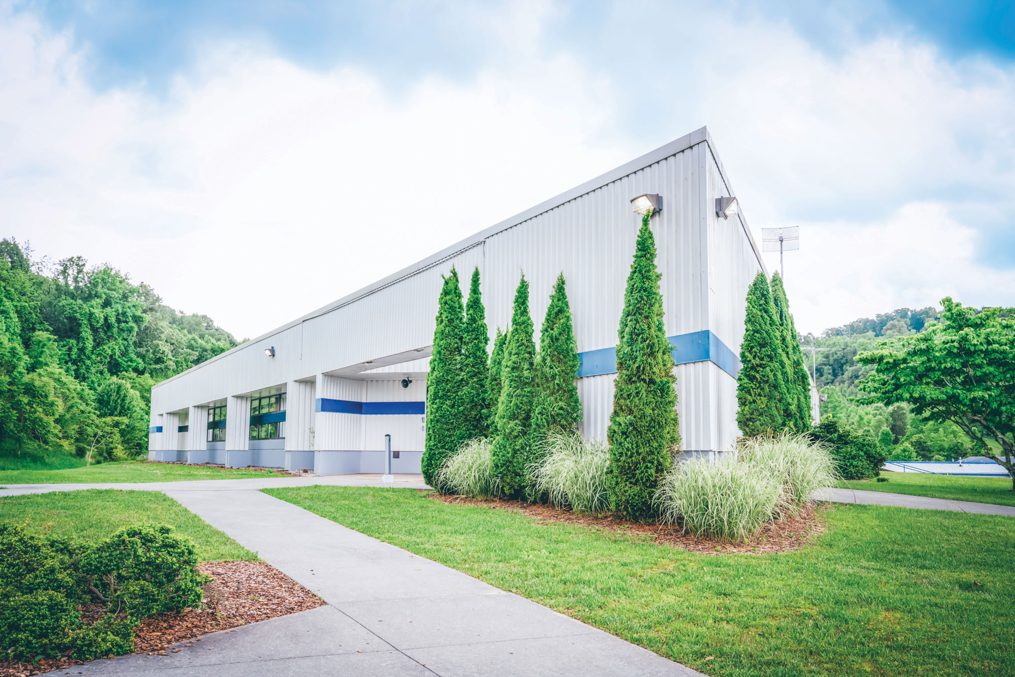 Exterior shot of a rectangular, metal building.