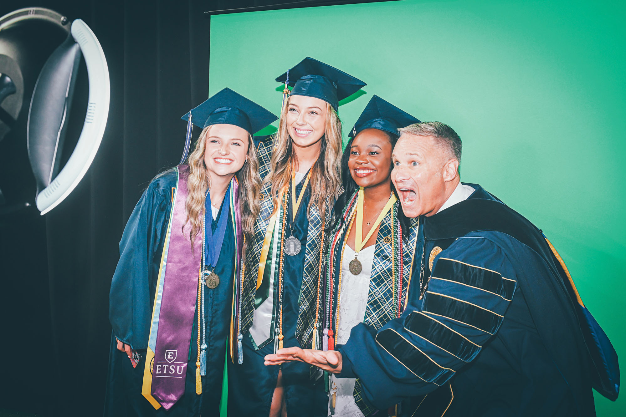 ETSU grads use the selfie station.