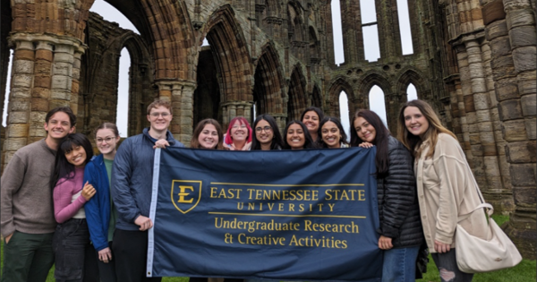students holding banner