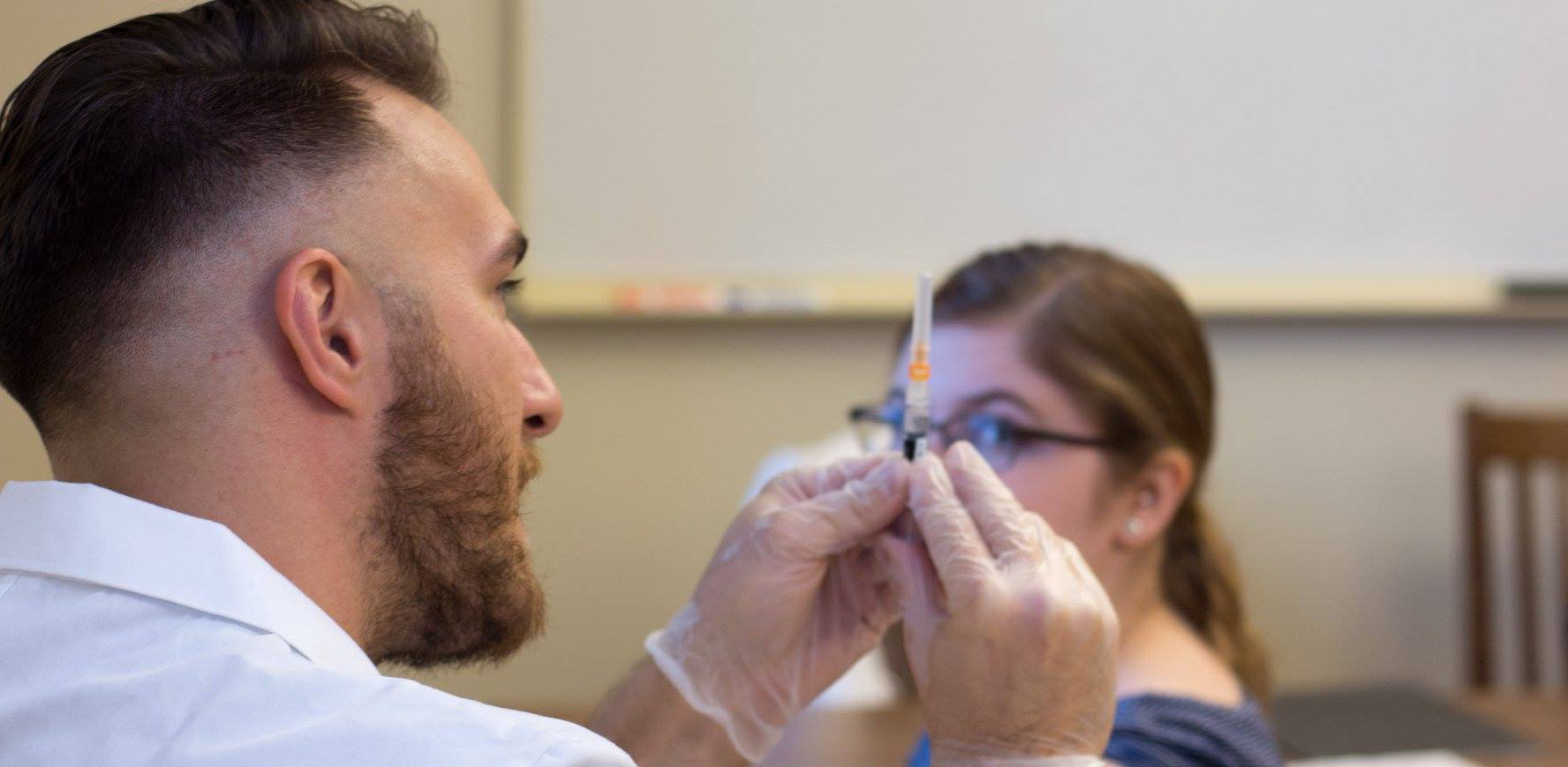 Student giving vaccine