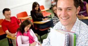 male student smiling in class