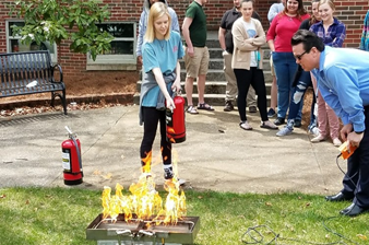 Student putting out a fire